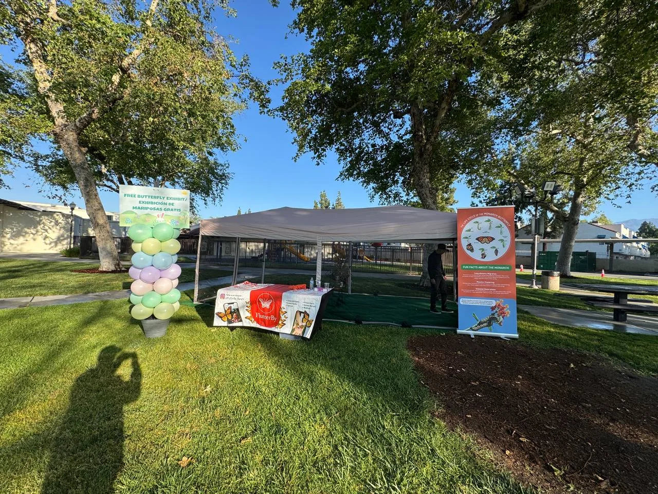 The branded exhibit tent at a public park
